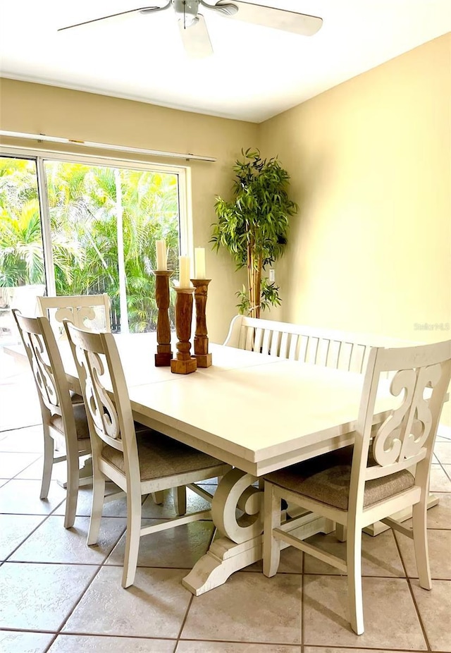 dining area featuring tile patterned flooring