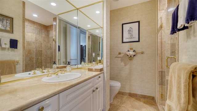 bathroom featuring toilet, tile walls, walk in shower, and vanity