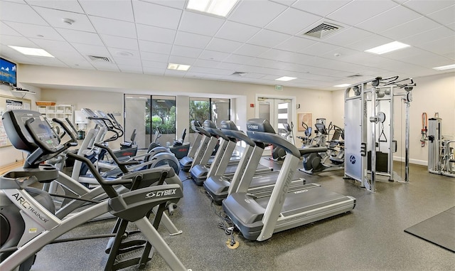 workout area featuring a drop ceiling