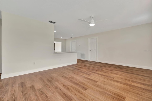 empty room featuring ceiling fan and light wood-type flooring