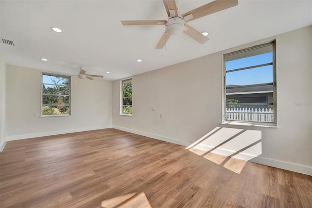 unfurnished room with light hardwood / wood-style floors and ceiling fan