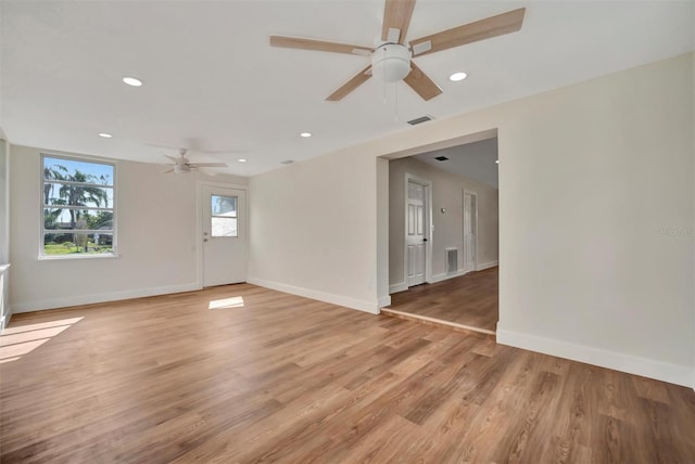 unfurnished room with ceiling fan and light hardwood / wood-style floors