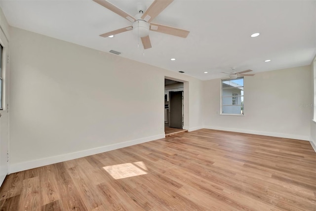 unfurnished room featuring ceiling fan and light hardwood / wood-style floors