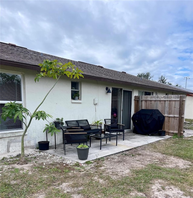 back of property with a patio