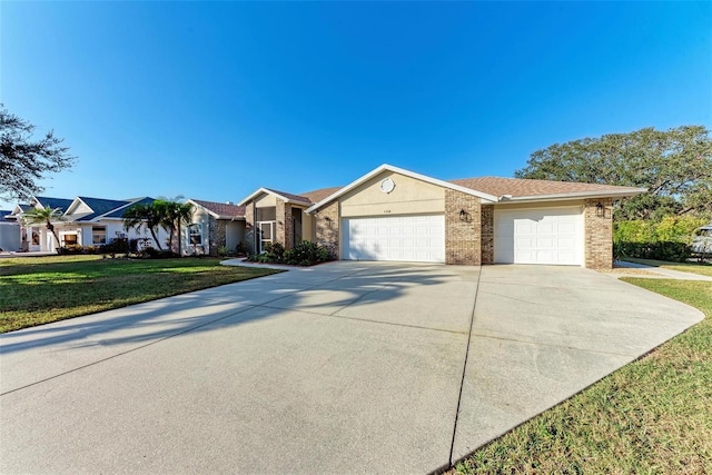 ranch-style home with a front yard and a garage