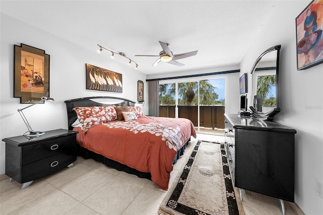 bedroom with light tile patterned flooring, ceiling fan, and access to exterior