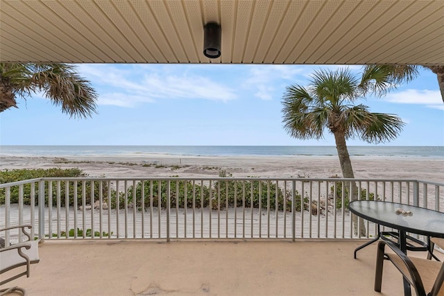 balcony with a beach view and a water view