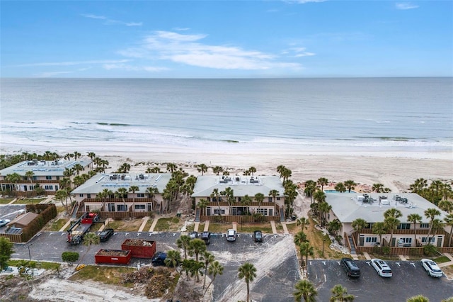 aerial view with a view of the beach and a water view