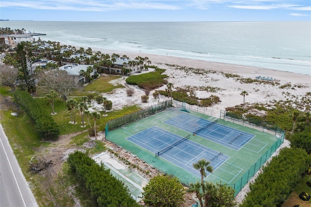 bird's eye view featuring a water view and a beach view