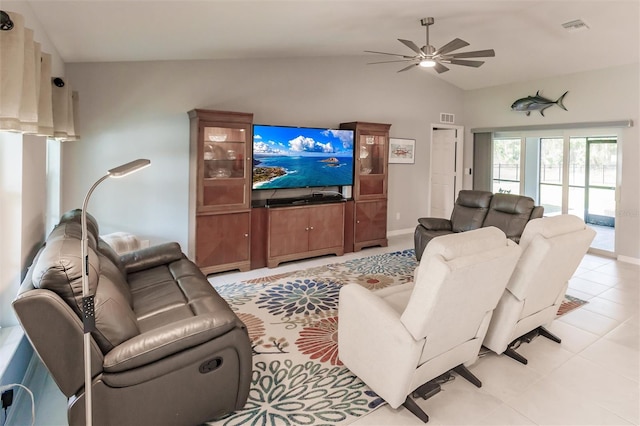 tiled living room with ceiling fan and vaulted ceiling