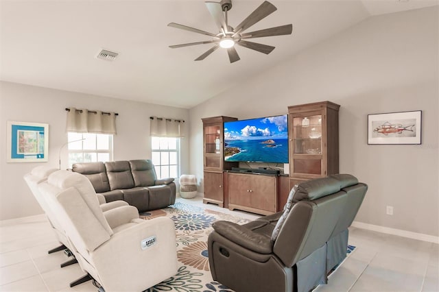 tiled living room with ceiling fan and vaulted ceiling