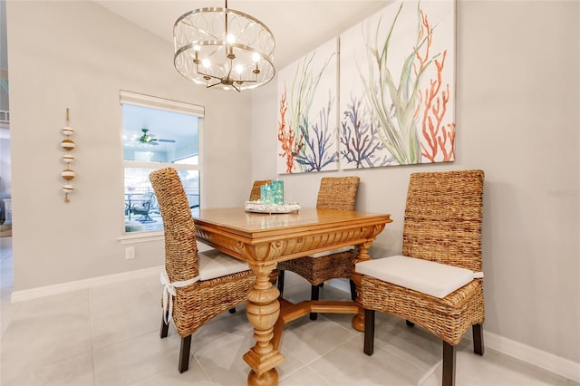 tiled dining space featuring a chandelier