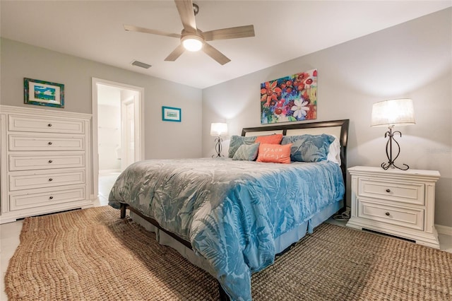 bedroom with ceiling fan and ensuite bathroom