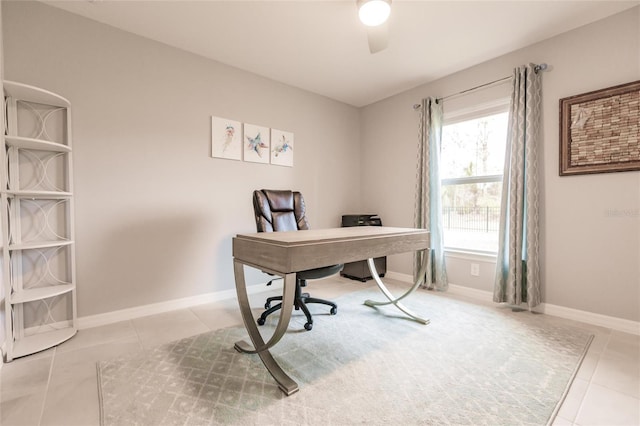 home office with ceiling fan, a healthy amount of sunlight, and light tile patterned flooring