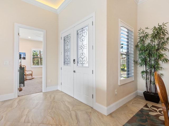 entryway featuring french doors, light colored carpet, and ornamental molding