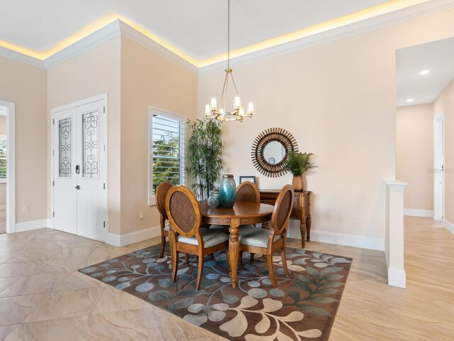 dining room featuring a notable chandelier and ornamental molding