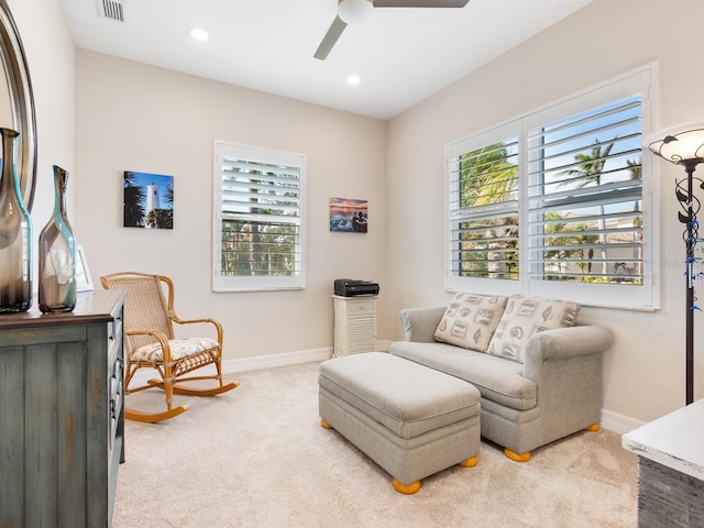 sitting room with light carpet and ceiling fan