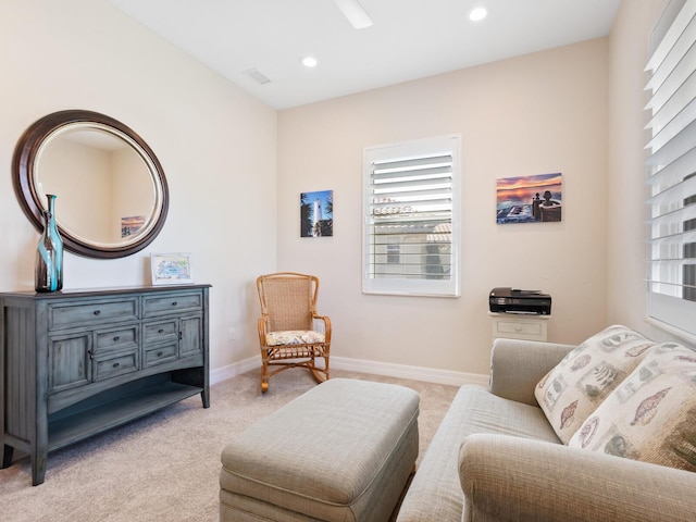 living area with light carpet