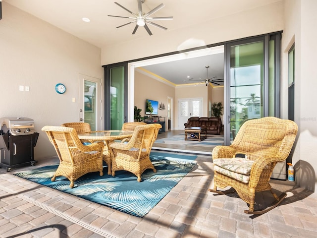 interior space featuring area for grilling, ceiling fan, and french doors