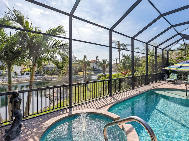 view of pool featuring glass enclosure and a water view