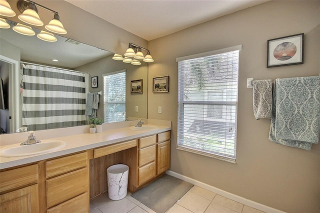 bathroom featuring tile patterned floors, a shower with shower curtain, and vanity