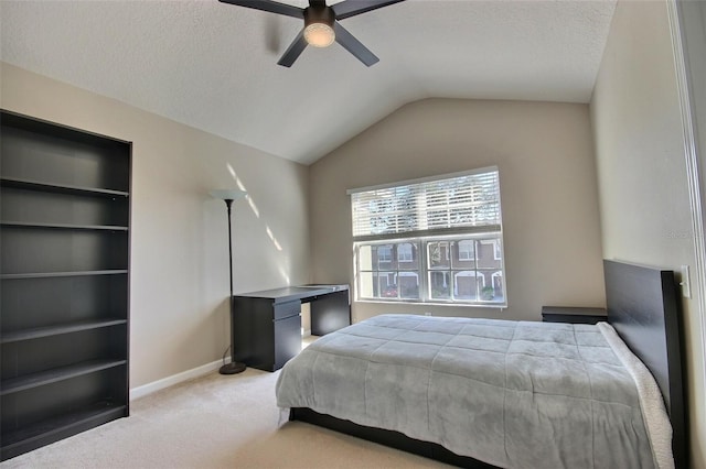 carpeted bedroom featuring lofted ceiling and ceiling fan