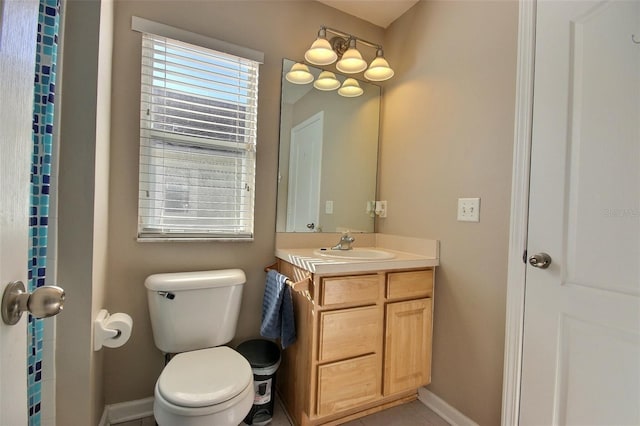 bathroom featuring toilet and vanity