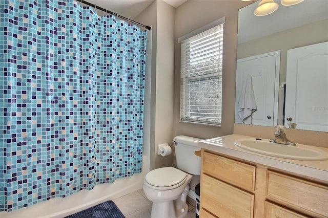 full bathroom with shower / tub combo, toilet, tile patterned flooring, and vanity