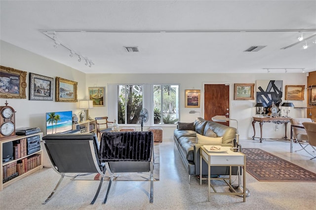 living room featuring track lighting