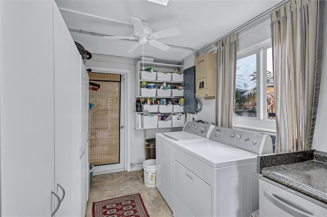 laundry area featuring ceiling fan, cabinets, and washing machine and dryer