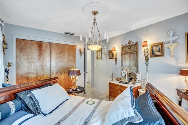 bedroom featuring light colored carpet and a closet