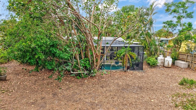 view of yard featuring a lanai