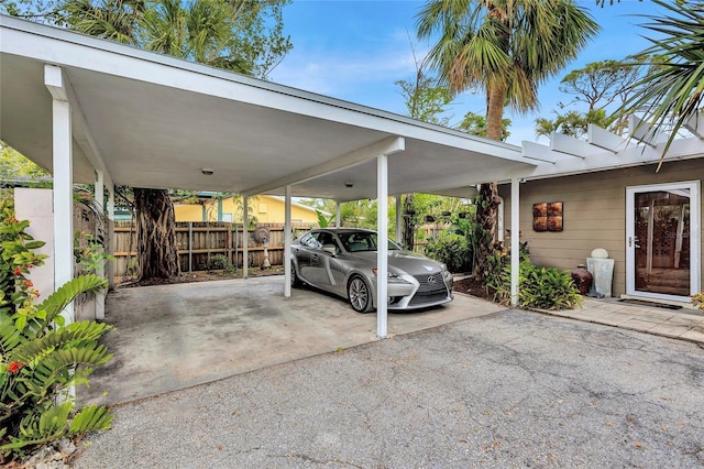 view of vehicle parking featuring a carport