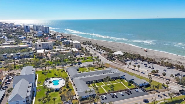 bird's eye view featuring a water view and a view of the beach