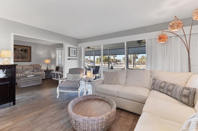 living room featuring hardwood / wood-style flooring and ceiling fan