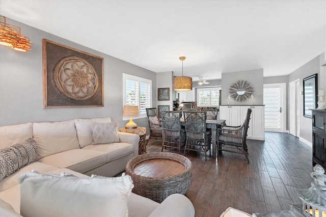 living area with dark wood-style floors and baseboards