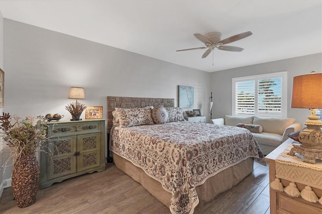 bedroom featuring wood finished floors and a ceiling fan