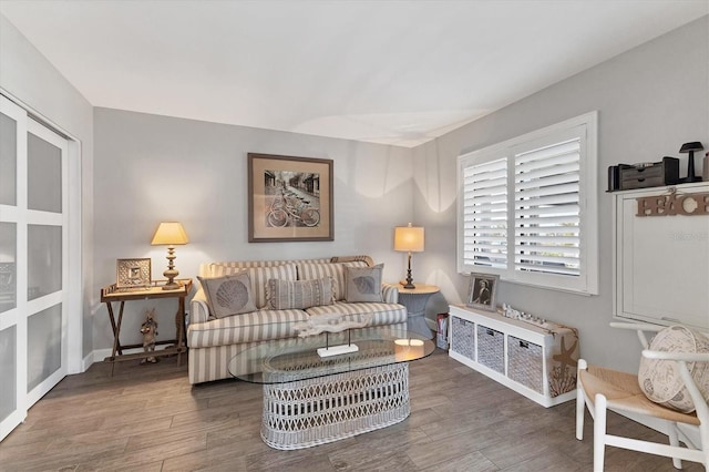 living area featuring wood finished floors and baseboards