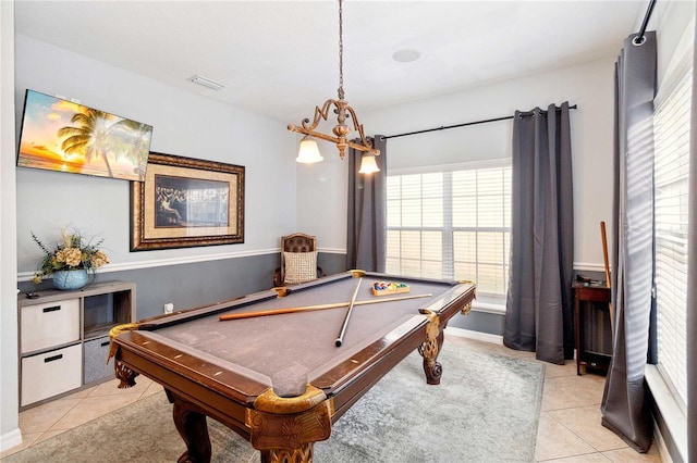 game room with pool table and light tile patterned floors