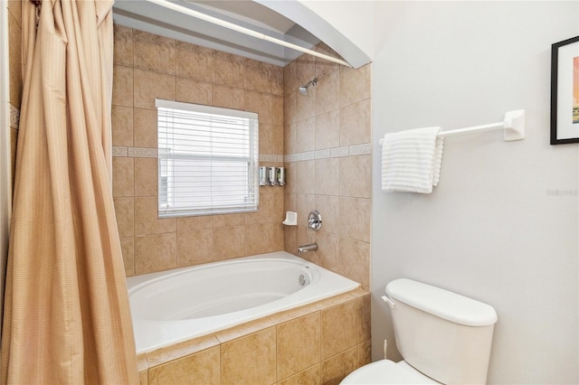 bathroom with shower / tub combo and toilet