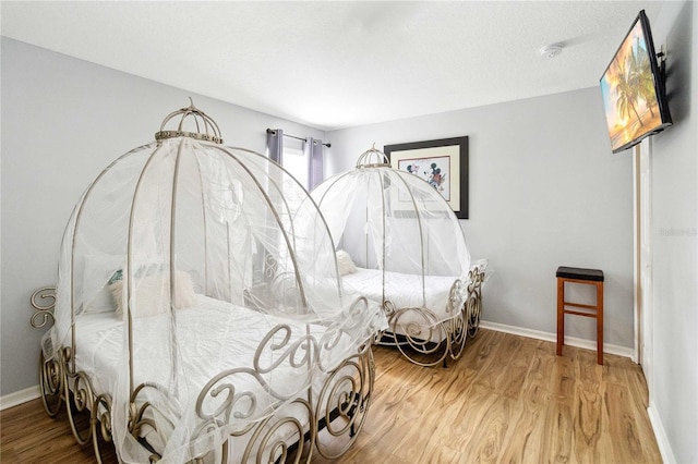 bedroom featuring hardwood / wood-style flooring