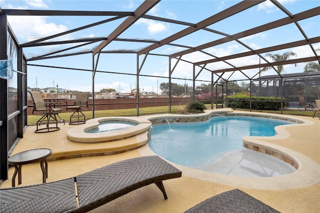 view of swimming pool featuring pool water feature, an in ground hot tub, glass enclosure, and a patio area