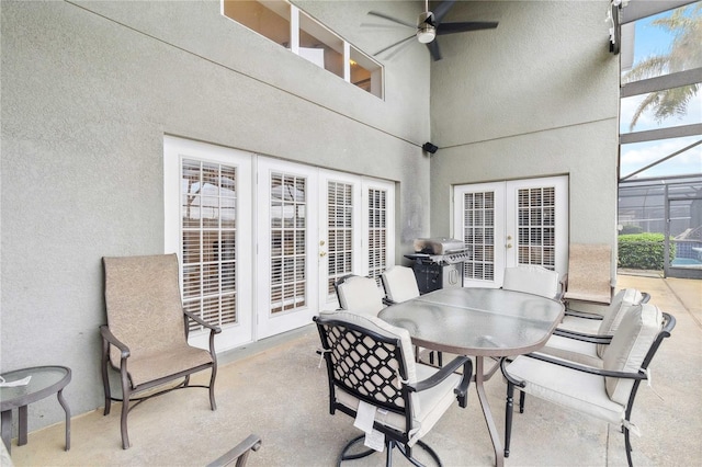 view of patio / terrace with ceiling fan, grilling area, and french doors