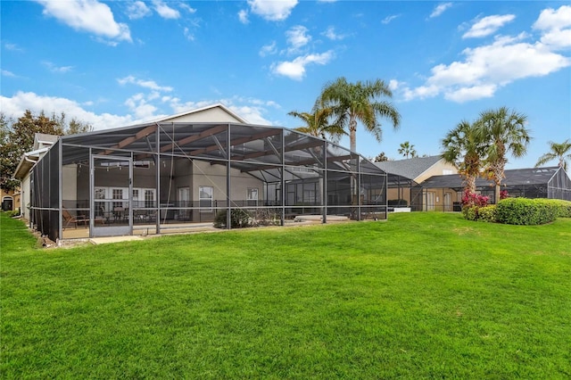 rear view of house featuring a yard