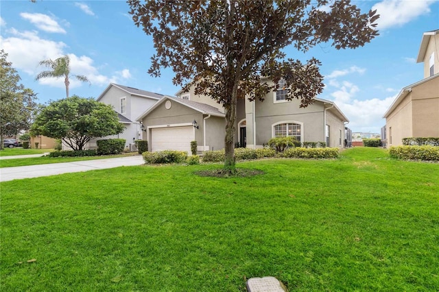 view of front of house featuring a front lawn and a garage