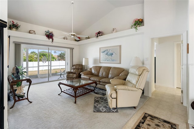 living room with a high ceiling and ceiling fan