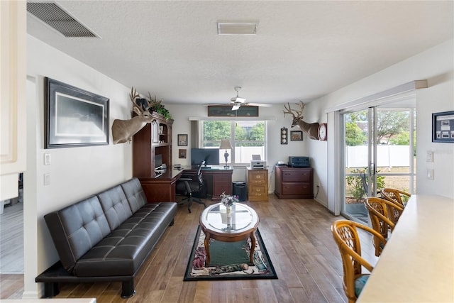 office with a textured ceiling, hardwood / wood-style floors, and ceiling fan