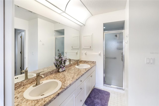 bathroom with an enclosed shower and vanity