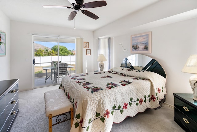 bedroom featuring ceiling fan, light colored carpet, and access to outside