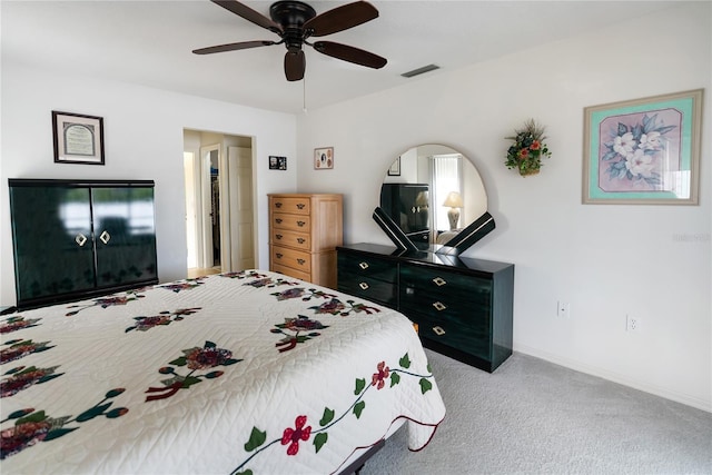 bedroom featuring ceiling fan and light colored carpet